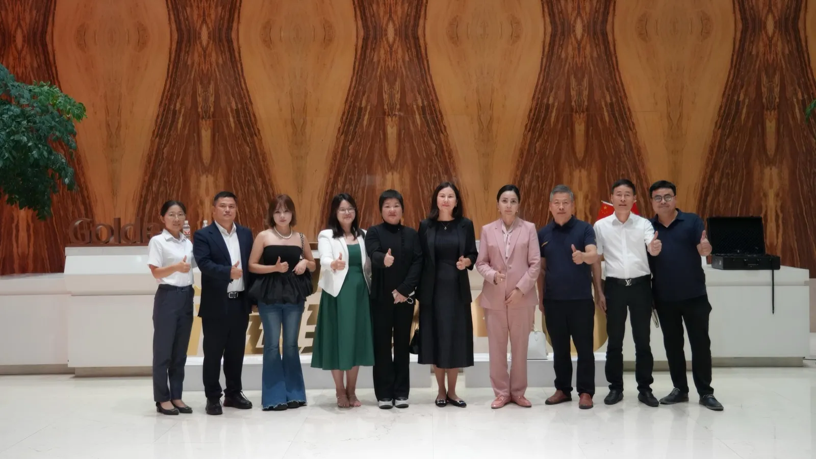 Ambassador Musaeva Aktilek and her delegation with Goldea Chairwoman Wang Lingjuan and executives at the Goldea flagship showroom