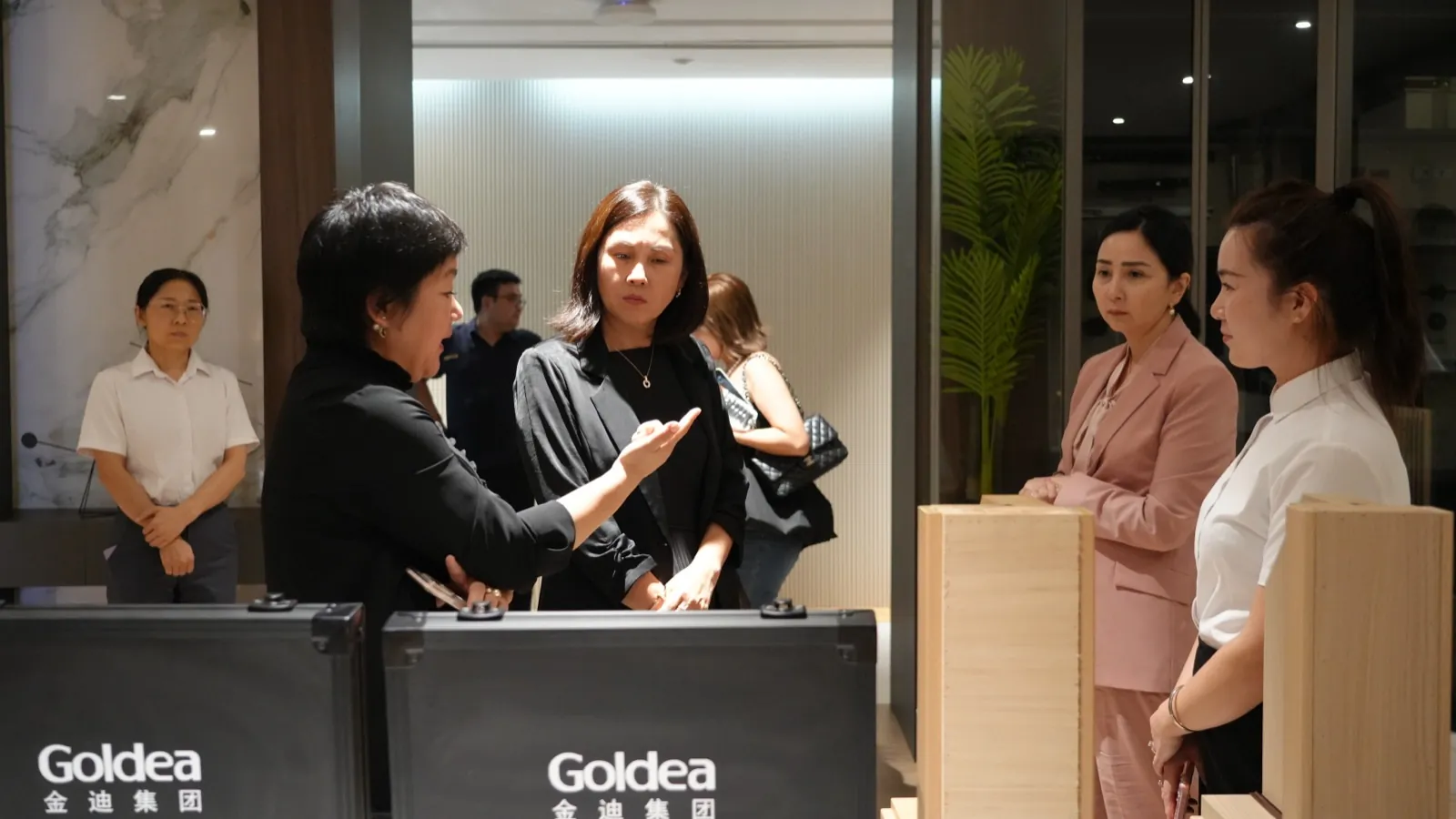 Discussions during the showroom visit, with Goldea products on display